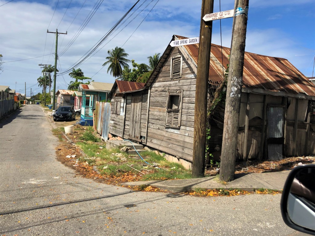 A board house at the corner of Black Rock Main Road