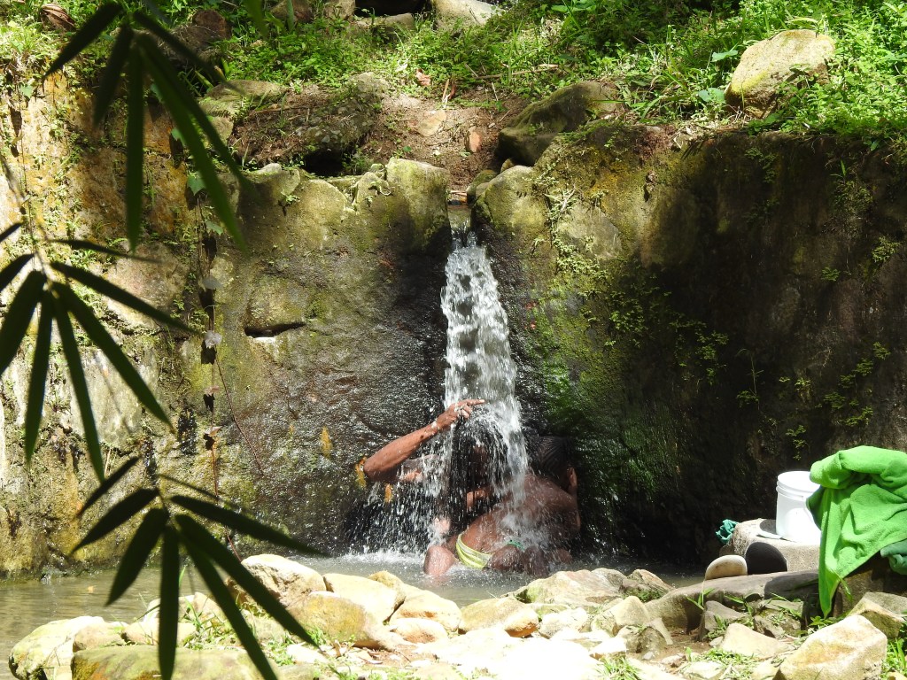 local-man-in-st.-lucia-enjoying-waterfall-with-his-daughter